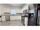 Modern kitchen with stainless steel appliances, granite countertops, and white cabinets at 2203 Beacon Crest Dr, Buford, GA 30519
