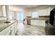 Open kitchen with stainless steel appliances and tile backsplash at 2203 Beacon Crest Dr, Buford, GA 30519