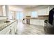 Well-lit kitchen featuring granite countertops, stainless steel appliances, and a dining area at 2203 Beacon Crest Dr, Buford, GA 30519