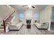 Bright living room with a fireplace, complemented by a cozy seating arrangement at 2203 Beacon Crest Dr, Buford, GA 30519