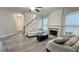 Bright and spacious living room with staircase and fireplace at 2203 Beacon Crest Dr, Buford, GA 30519