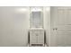 Powder room featuring a vanity, mirror, and a clean, minimalist design at 2203 Beacon Crest Dr, Buford, GA 30519