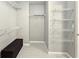 Walk-in closet with installed shelving and bench for storage and organization at 2203 Beacon Crest Dr, Buford, GA 30519