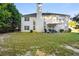 Spacious backyard featuring mature trees, lush grass and back of home at 10 Bunker Lane St, Covington, GA 30014