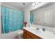 Colorful bathroom featuring a shower and bathtub at 10 Bunker Lane St, Covington, GA 30014