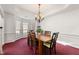 Dining room with a bay window, chandelier, and classic trim at 10 Bunker Lane St, Covington, GA 30014