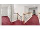 Bright second-floor hallway featuring wood railing and spindles overlooking the foyer at 10 Bunker Lane St, Covington, GA 30014