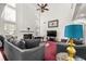 Bright and airy living room features a vaulted ceiling, lots of natural light, and comfortable seating at 10 Bunker Lane St, Covington, GA 30014