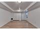 Finished basement with modern flooring, closet, access door, and natural light at 1635 Rushing River Way, Suwanee, GA 30024