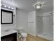 Well-lit bathroom featuring a sleek vanity and modern shower at 1635 Rushing River Way, Suwanee, GA 30024