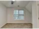 Bedroom with window showing tree line at 1635 Rushing River Way, Suwanee, GA 30024
