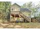 Back exterior of home with stairs to deck at 1635 Rushing River Way, Suwanee, GA 30024