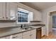 Kitchen with granite counter tops, stainless steel appliances, and lots of natural light at 1635 Rushing River Way, Suwanee, GA 30024