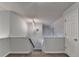 Carpeted staircase with white walls and railings leads upstairs at 1635 Rushing River Way, Suwanee, GA 30024