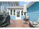 Cozy deck with grill, seating, and blue siding on house at 505 Alta Ct, Villa Rica, GA 30180