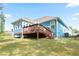 Expansive backyard featuring a wood deck and a house with light blue siding, perfect for outdoor enjoyment at 505 Alta Ct, Villa Rica, GA 30180