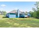 Wide view of a home and backyard, including a sunroom and deck at 505 Alta Ct, Villa Rica, GA 30180