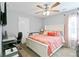 Comfortable bedroom with a ceiling fan, neutral walls, and a view of the outdoors at 505 Alta Ct, Villa Rica, GA 30180