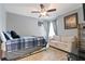 Cozy bedroom features a bed, sofa, and light gray paint at 505 Alta Ct, Villa Rica, GA 30180