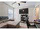 Functional bedroom includes large TV, shelving unit, ceiling fan and closet at 505 Alta Ct, Villa Rica, GA 30180