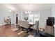 Well-lit dining room with hardwood floors, a modern chandelier, and stylish furnishings at 505 Alta Ct, Villa Rica, GA 30180