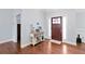 Welcoming foyer with hardwood floors, a wooden console table, and a view of the front door at 505 Alta Ct, Villa Rica, GA 30180