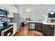 Spacious kitchen boasts granite countertops, stainless steel appliances, and opens to a comfortable living area at 505 Alta Ct, Villa Rica, GA 30180