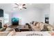 Bright and airy living room with a large sofa, hardwood floors, and an aquarium at 505 Alta Ct, Villa Rica, GA 30180