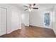 Bedroom with hardwood floors, ceiling fan, closet, and a connecting bathroom at 1345 Sw Dodson Dr, Atlanta, GA 30311