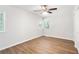 Bedroom with hardwood floors, window, ceiling fan, and closet at 1345 Sw Dodson Dr, Atlanta, GA 30311