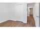 Bedroom with hardwood floors, closet, and doorway leading to the hallway at 1345 Sw Dodson Dr, Atlanta, GA 30311