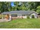 Lovely brick home featuring a long carport, updated windows, and a quaint, elevated wood deck at 1345 Sw Dodson Dr, Atlanta, GA 30311