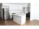 Kitchen with white cabinets, stainless steel appliances and a center island at 1345 Sw Dodson Dr, Atlanta, GA 30311