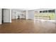 Living room with hardwood floors, and an eat-in kitchen with white cabinets and stainless steel appliances at 1345 Sw Dodson Dr, Atlanta, GA 30311