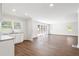 Open-concept living space features hardwood floors, recessed lighting, and sliding glass doors at 1345 Sw Dodson Dr, Atlanta, GA 30311
