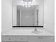 Bright bathroom features a large mirror, white vanity with drawers, and a full bath with shower at 1692 Holcomb Lake Rd, Marietta, GA 30062