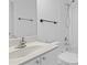 Bright bathroom with a white vanity, toilet, and shower/tub combo at 1692 Holcomb Lake Rd, Marietta, GA 30062