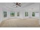 Large bonus room features neutral carpet and bright windows with natural light and views at 1692 Holcomb Lake Rd, Marietta, GA 30062