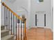 Elegant foyer with gleaming hardwood floors, staircase, and abundant natural light at 1692 Holcomb Lake Rd, Marietta, GA 30062