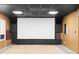 Spacious home theater setup features a large screen, surround sound speakers, and comfortable carpet at 1692 Holcomb Lake Rd, Marietta, GA 30062
