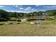 Scenic lake view with benches overlooking the water, providing a serene and peaceful atmosphere at 1692 Holcomb Lake Rd, Marietta, GA 30062