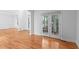 Bright living room with hardwood floors, french doors, and elegant trim at 1692 Holcomb Lake Rd, Marietta, GA 30062