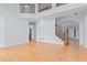 Open-concept living area with hardwood floors, high ceilings, and abundant natural light at 1692 Holcomb Lake Rd, Marietta, GA 30062