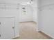 Walk-in closet provides ample storage space with built-in shelving, rods, and natural lighting at 1692 Holcomb Lake Rd, Marietta, GA 30062