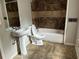 Bathroom featuring a tub/shower combo, white vanity, and modern fixtures at 2756 Del Ridge Dr, Douglasville, GA 30135