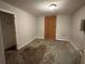 An empty bedroom featuring neutral walls, a standard ceiling light, and a wall with wood paneling at 2756 Del Ridge Dr, Douglasville, GA 30135