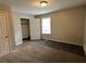 Bedroom with neutral carpet, a closet, and a window providing natural light at 2756 Del Ridge Dr, Douglasville, GA 30135