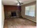 Cozy living room featuring a stone fireplace and hardwood flooring at 2756 Del Ridge Dr, Douglasville, GA 30135