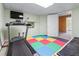 Basement workout area featuring colorful flooring and exercise equipment at 2978 Legislative Ln, Buford, GA 30519