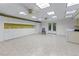 Spacious basement with built-in cabinets, double doors, tile floors, and recessed lighting at 2978 Legislative Ln, Buford, GA 30519